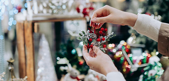 Person holding christmas decoration